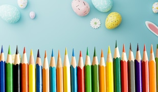 Bunte Stifte vor einem Oster Hintergrund