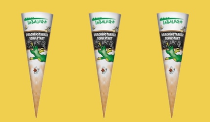 Tabaluga Schultüten von Netto Marken-Discount und Edeka vor gelbem Hintergrund