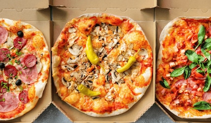 Happy Slice: Eigene Pizza-Marke von Knossi & Trymacs