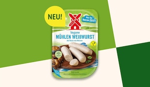 Vegane Mühlen Weißwurst vor grünem Hintergrund